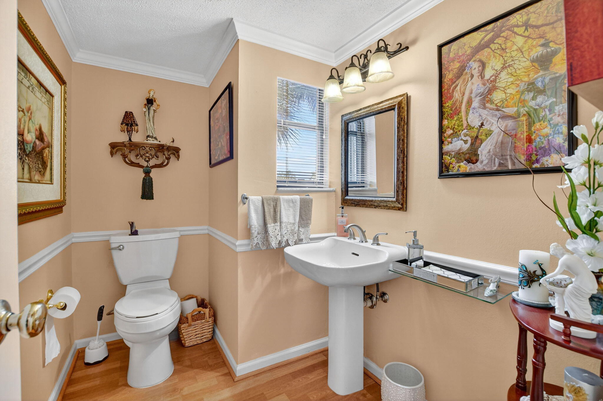 5650 Camino Del Sol, Unit 200 Boca Raton, FL 33433 - Photo 28 of 38 a bathroom with a toilet sink and mirror