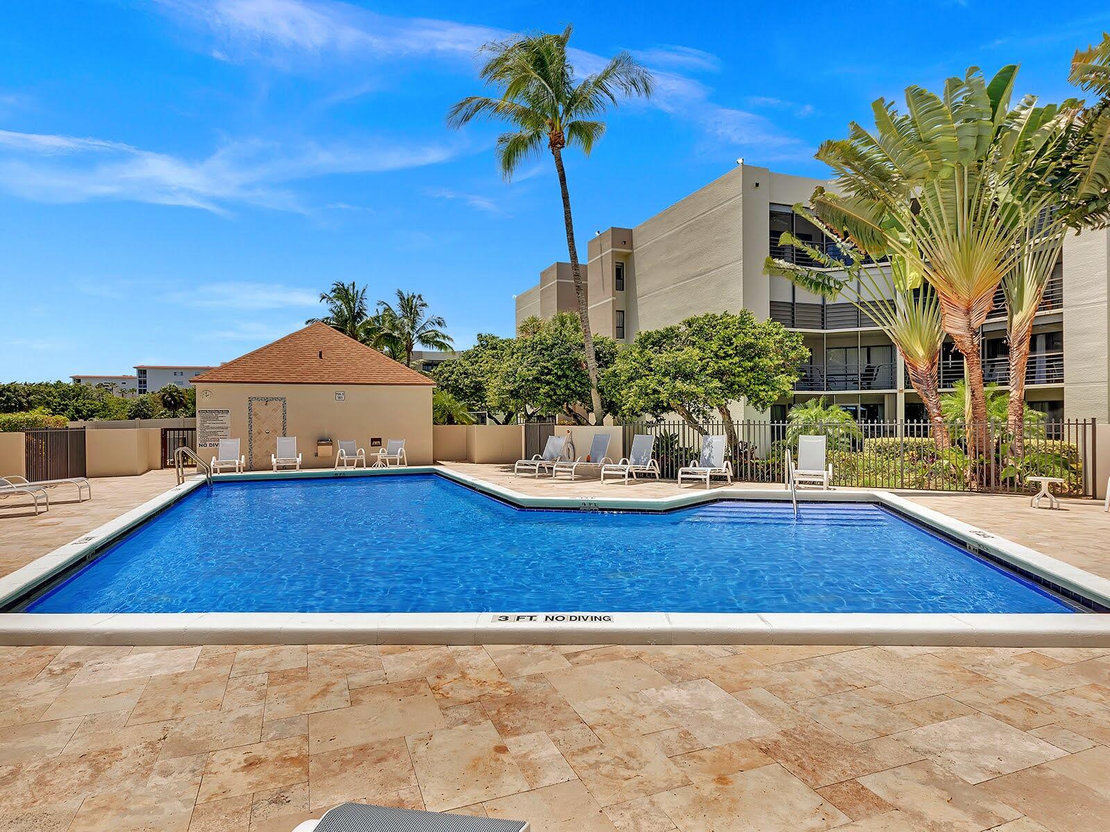 5650 Camino Del Sol, Unit 200 Boca Raton, FL 33433 - Photo 34 of 38 a view of a house with pool yard and a patio