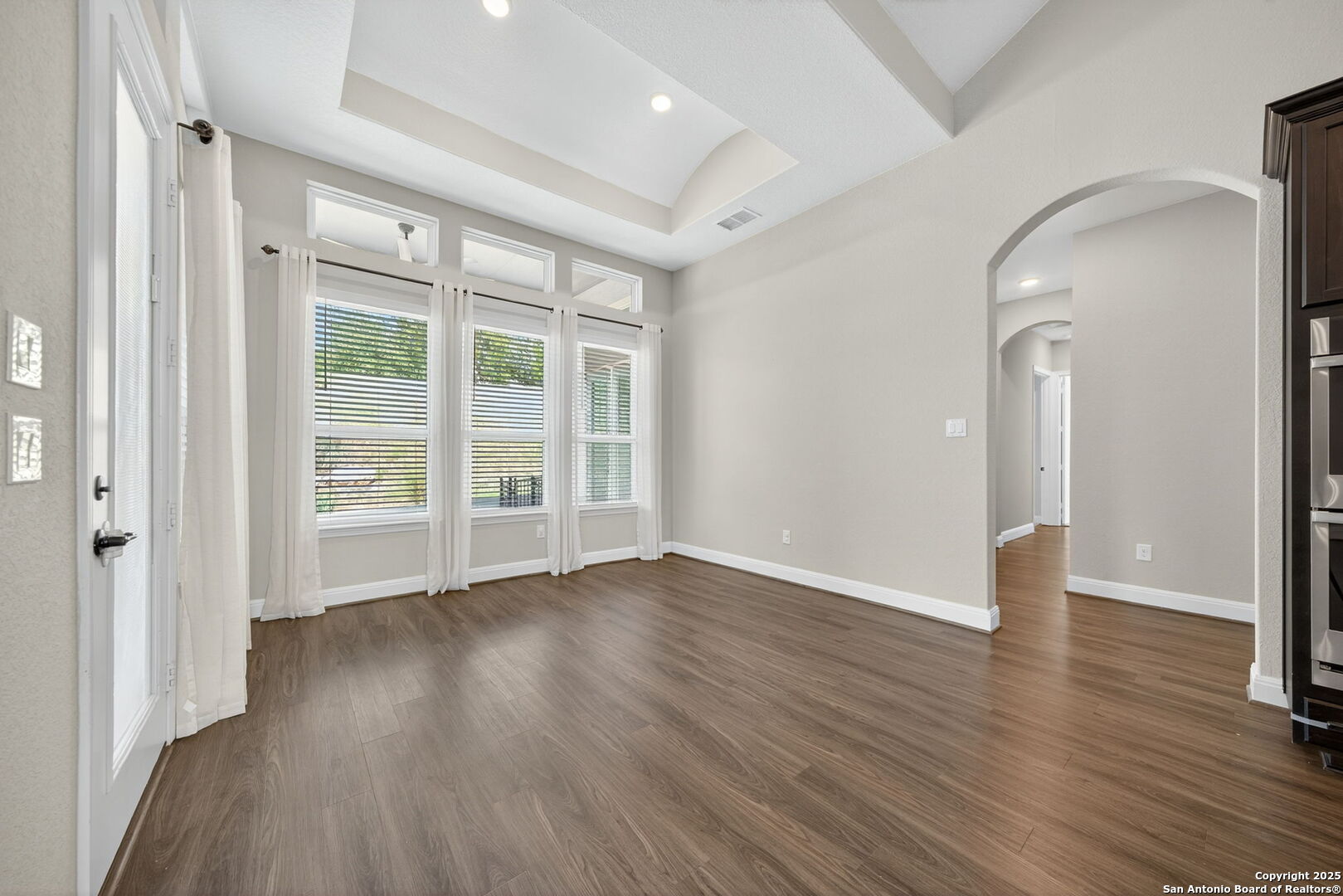 8283 Apache Forest Garden Ridge, TX 78266 - Photo 14 of 42 wooden floor in an empty room with a window