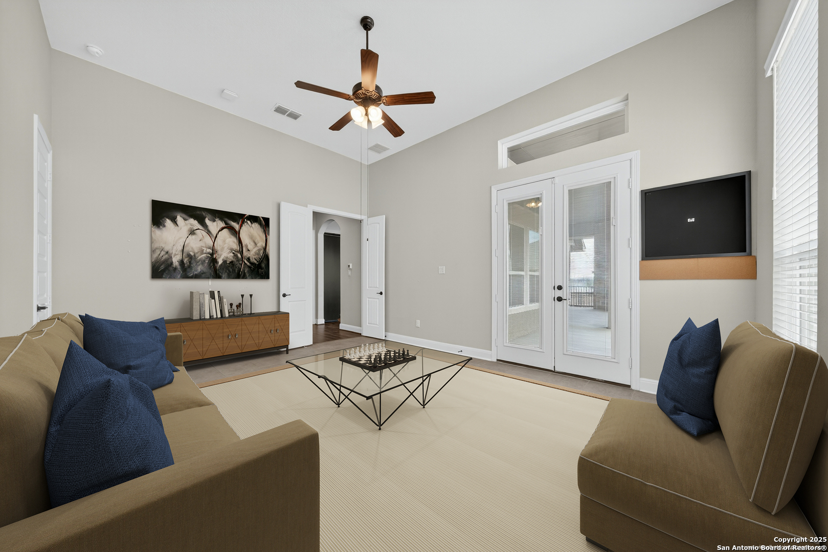 8283 Apache Forest Garden Ridge, TX 78266 - Photo 16 of 42 a living room with furniture and a flat screen tv