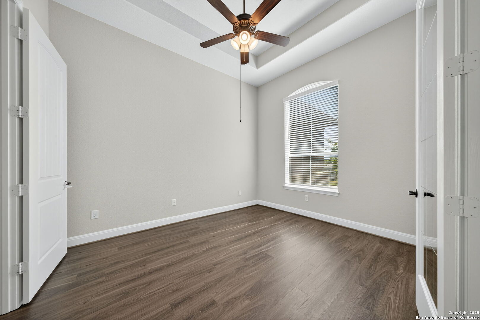 8283 Apache Forest Garden Ridge, TX 78266 - Photo 19 of 42 wooden floor in an empty room with a window