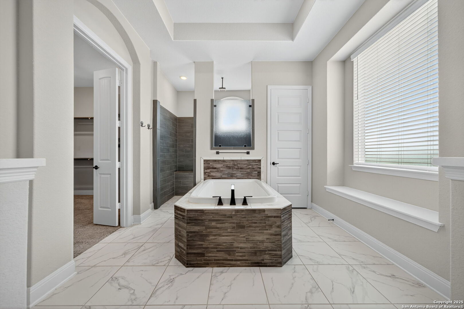 8283 Apache Forest Garden Ridge, TX 78266 - Photo 24 of 42 a spacious bathroom with a tub sink and mirror