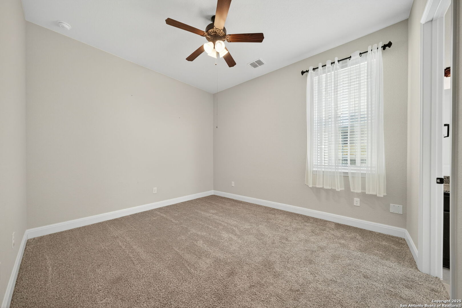 8283 Apache Forest Garden Ridge, TX 78266 - Photo 31 of 42 a view of an empty room with a window