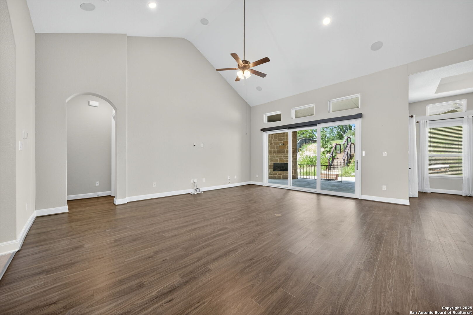 8283 Apache Forest Garden Ridge, TX 78266 - Photo 6 of 42 a view of an empty room with wooden floor and a window