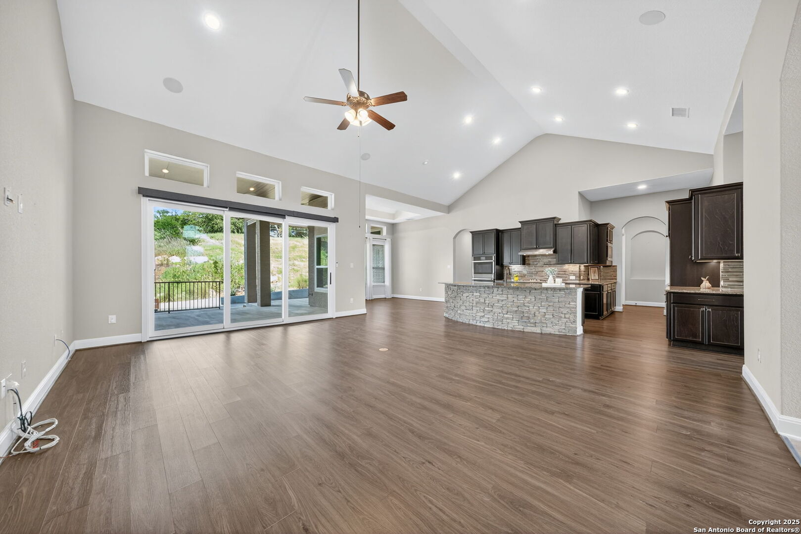 8283 Apache Forest Garden Ridge, TX 78266 - Photo 8 of 42 a view of kitchen and dining room with wooden floor