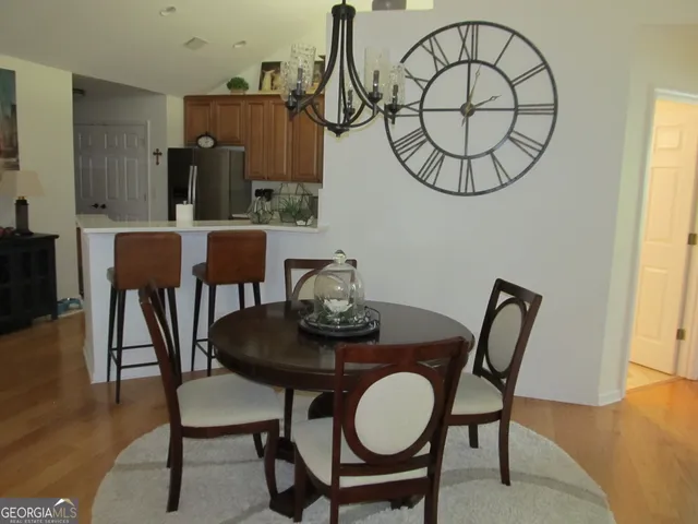a kitchen with stainless steel appliances granite countertop a refrigerator sink and cabinets
