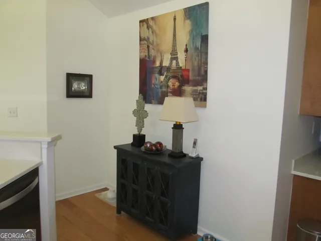 a bathroom with sink a mirror and a shower