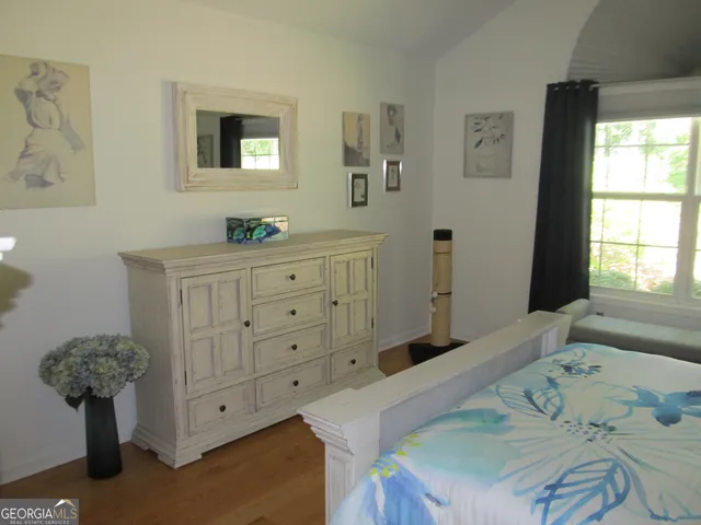 a view of a dining room with furniture and a large window