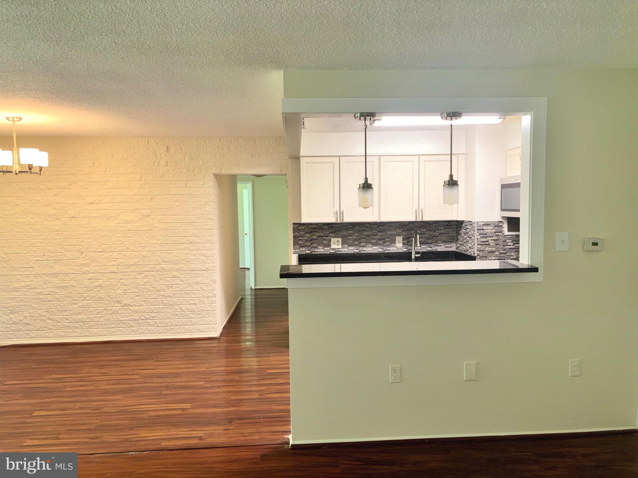 1832 Metzerott Road, Unit 105 Hyattsville, MD 20783 - Photo 3 of 16 a view of a refrigerator in front of it