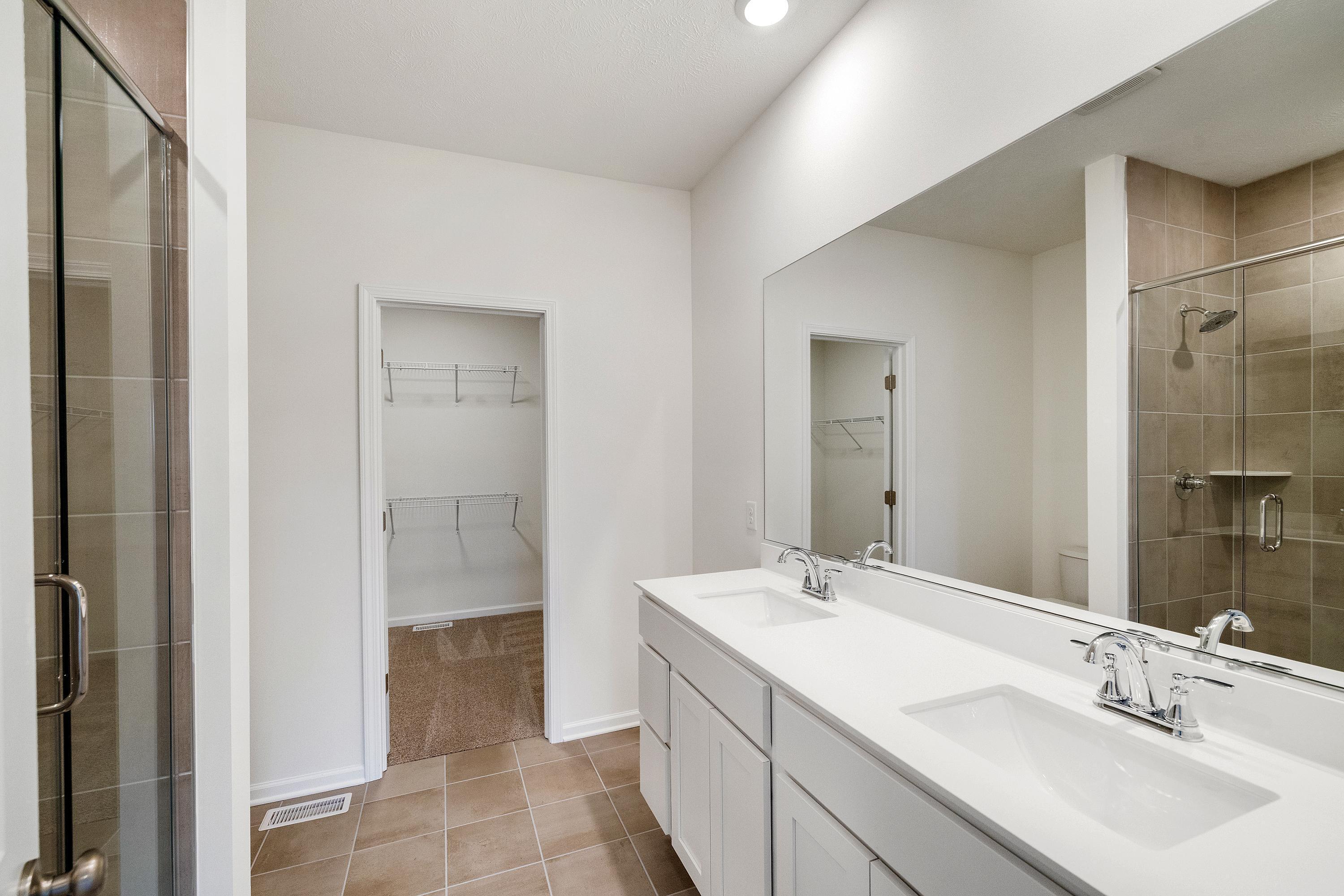 5264 Red Rock Lane Schererville, IN 46375 - Photo 13 of 21 a bathroom with a double vanity sink and a mirror