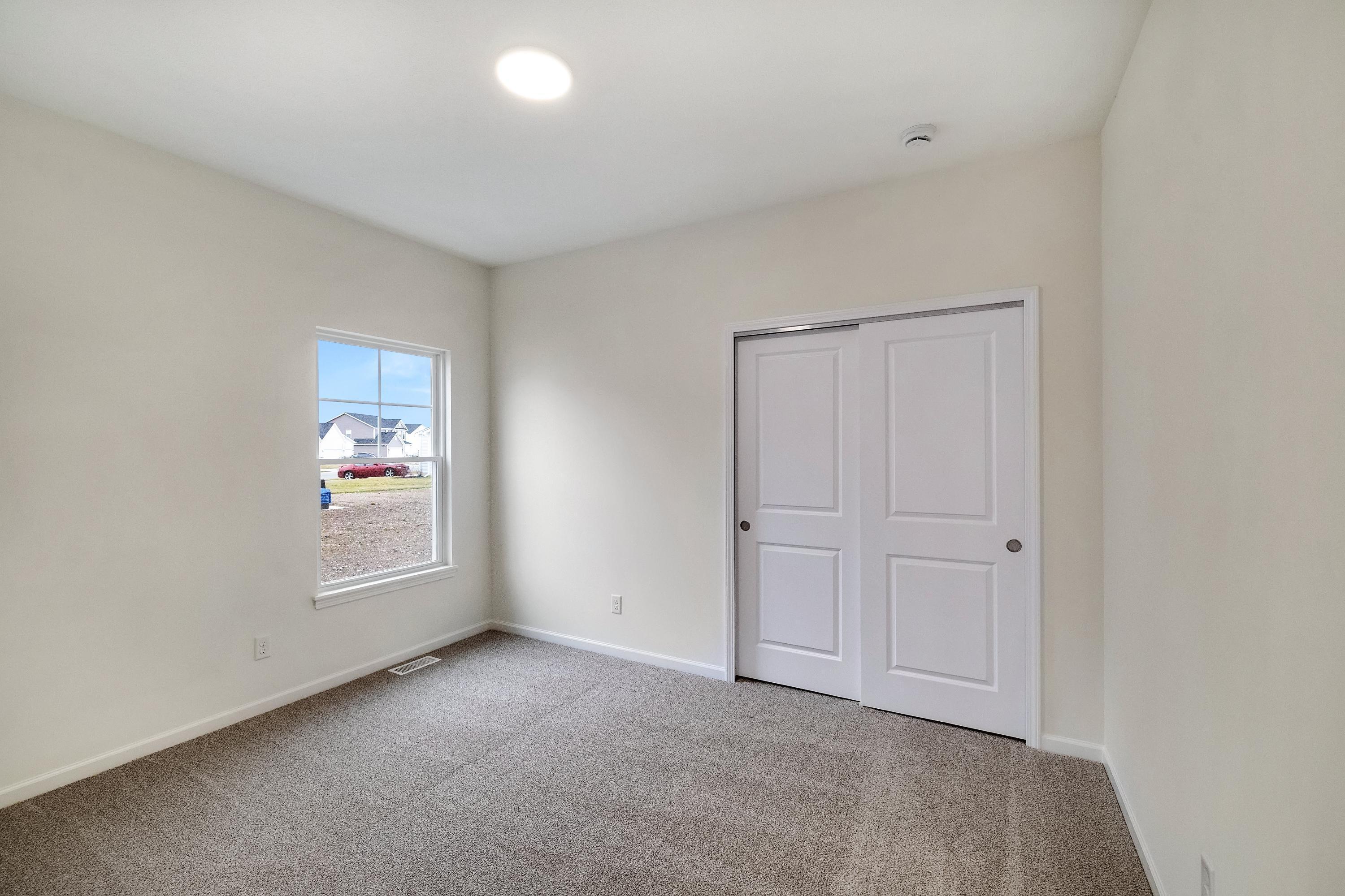 5264 Red Rock Lane Schererville, IN 46375 - Photo 17 of 21 an empty room with windows and closet