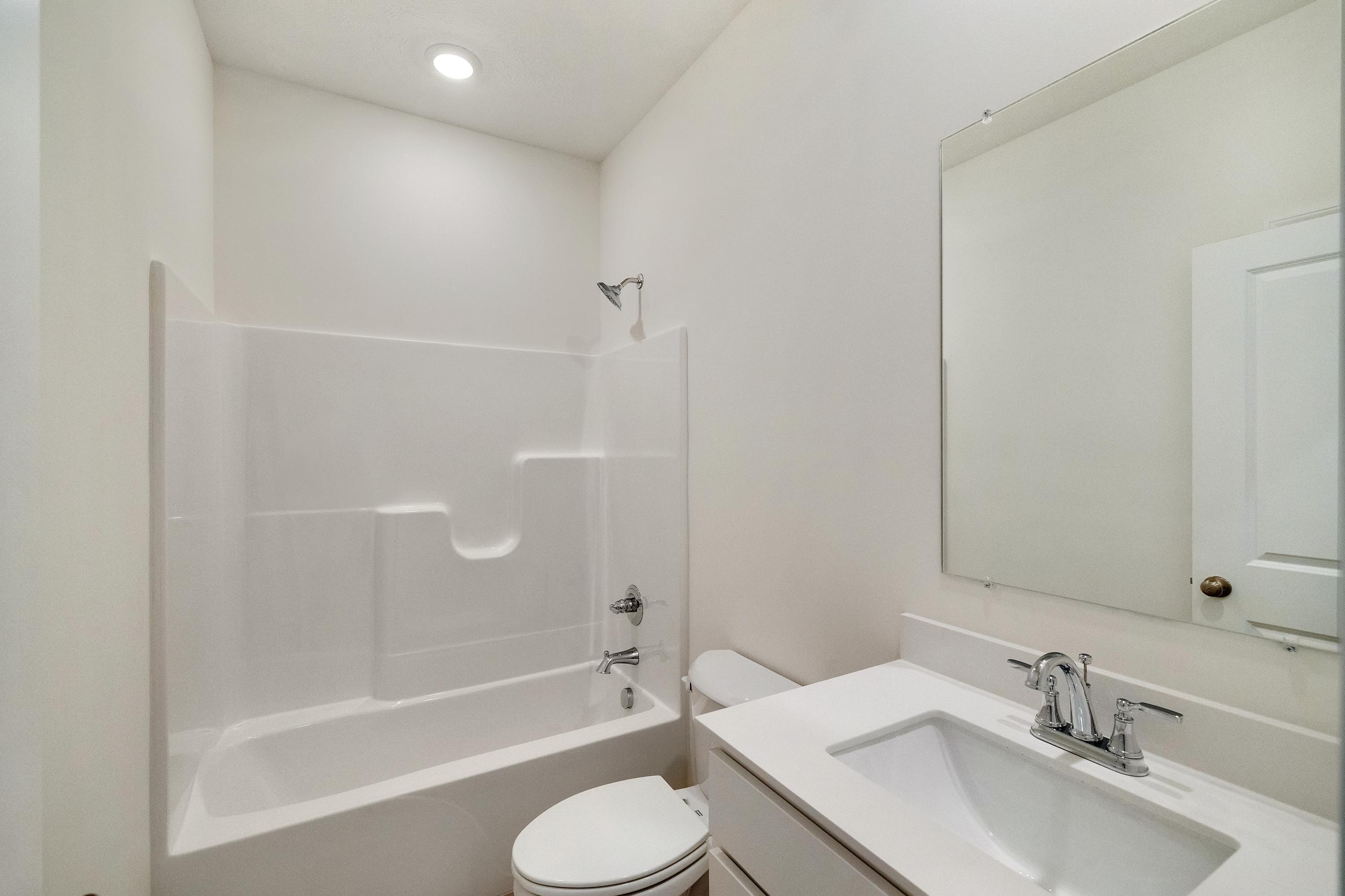 5264 Red Rock Lane Schererville, IN 46375 - Photo 18 of 21 a bathroom with a granite countertop sink toilet and shower