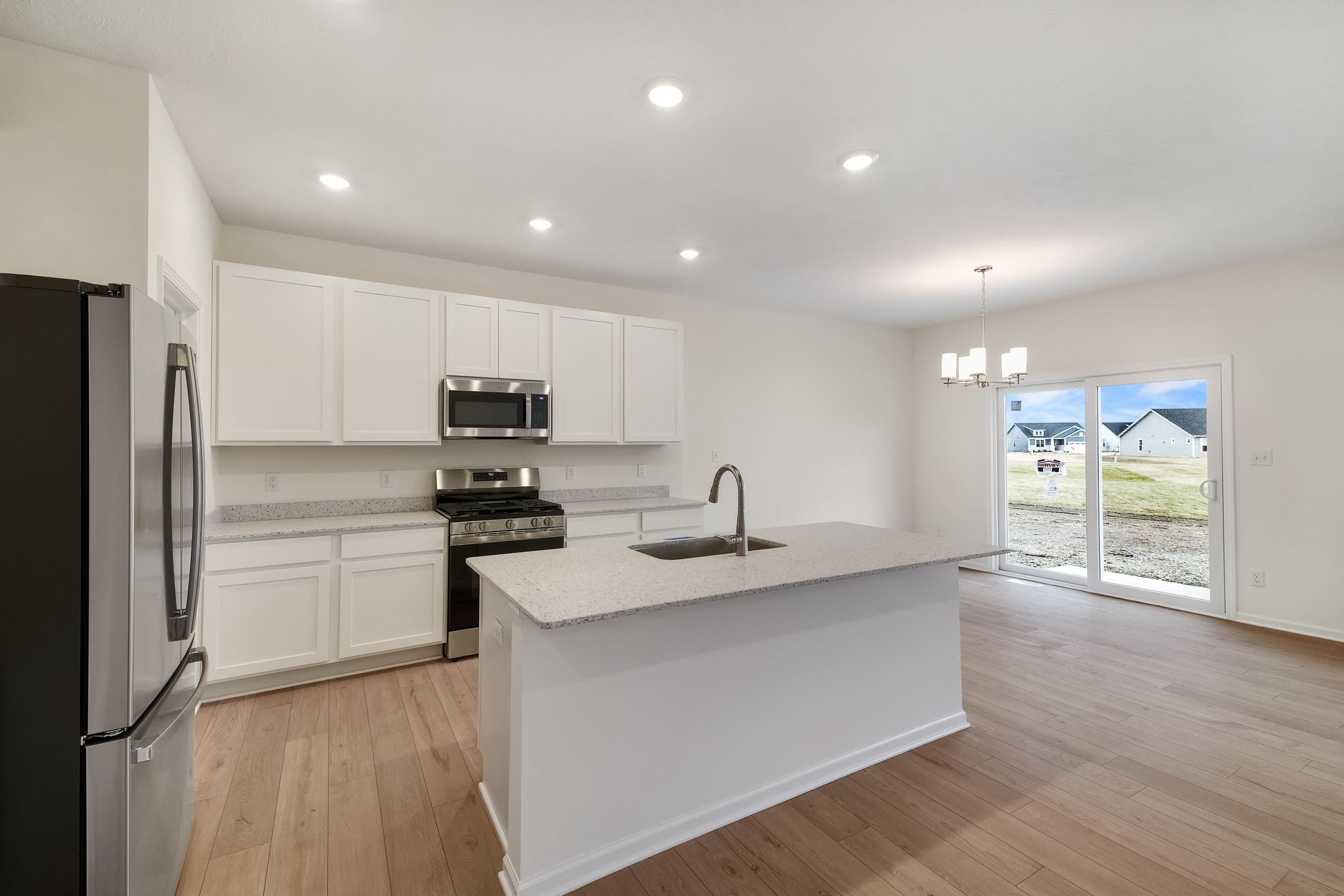 5264 Red Rock Lane Schererville, IN 46375 - Photo 3 of 21 a kitchen with a sink stainless steel appliances and cabinets