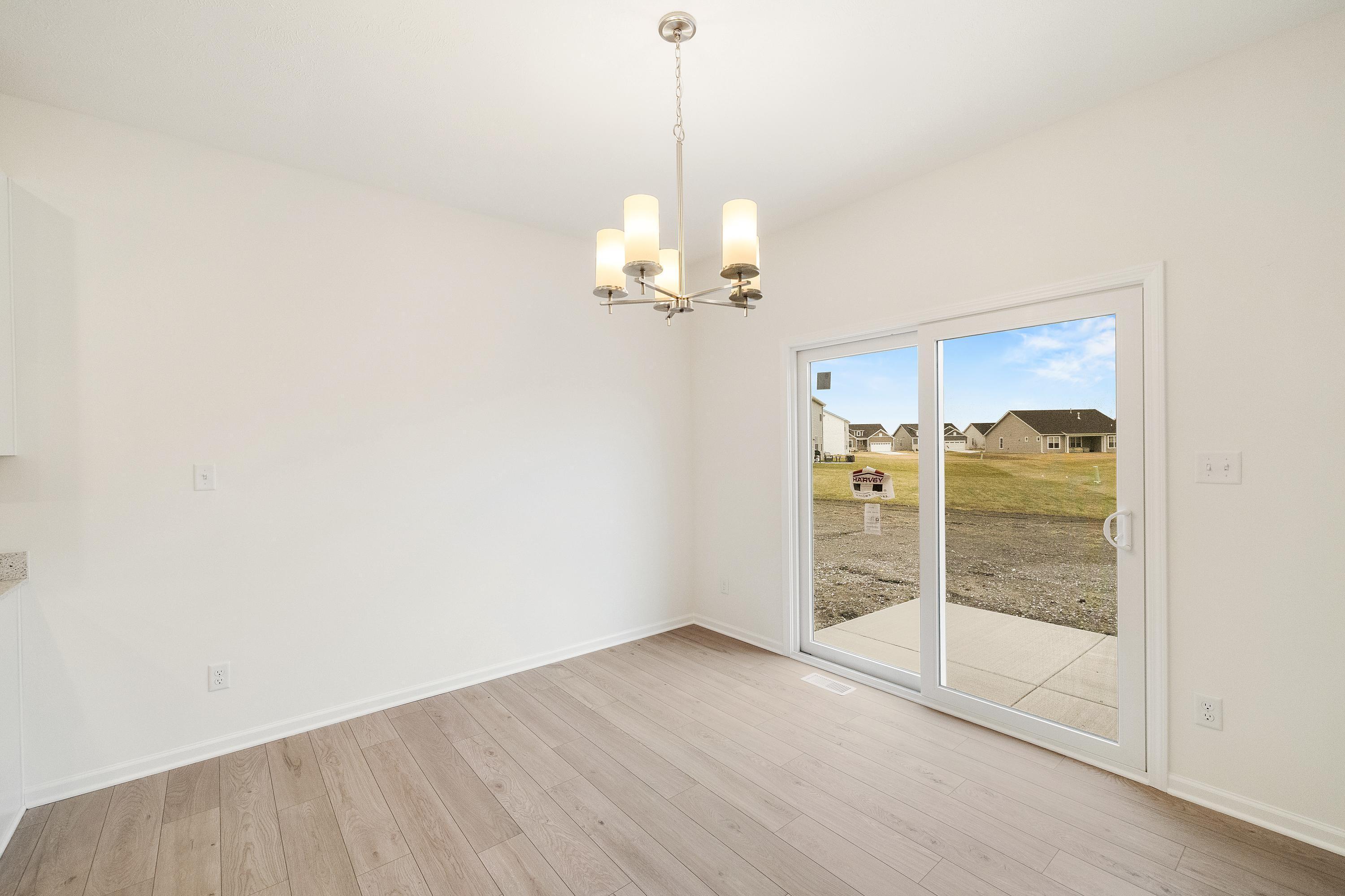 5264 Red Rock Lane Schererville, IN 46375 - Photo 5 of 21 a view of a chandelier in an empty room