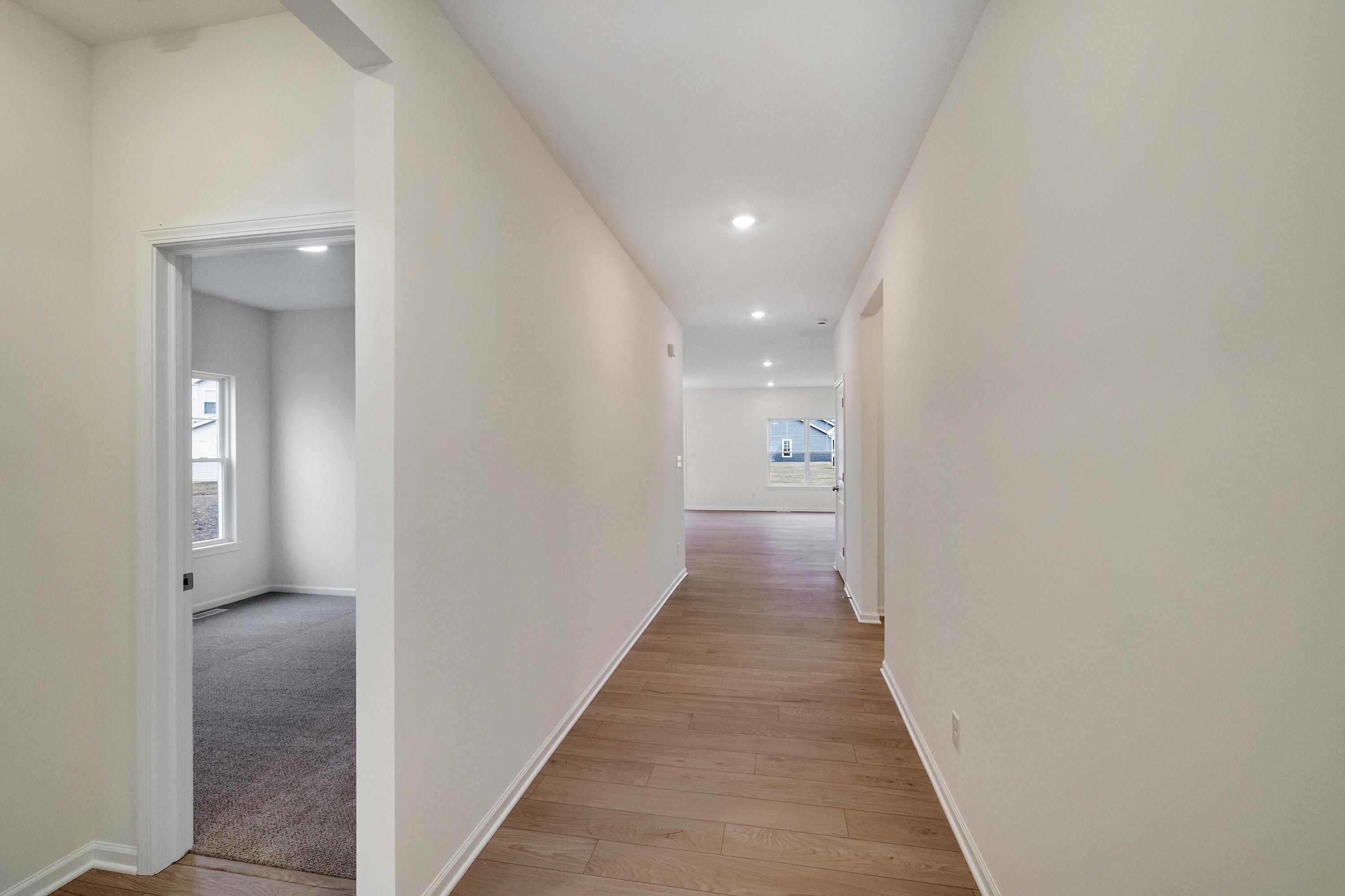 5264 Red Rock Lane Schererville, IN 46375 - Photo 10 of 21 a view of a hallway with wooden floor