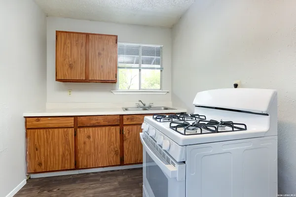 a white refrigerator freezer sitting inside of a kitchen