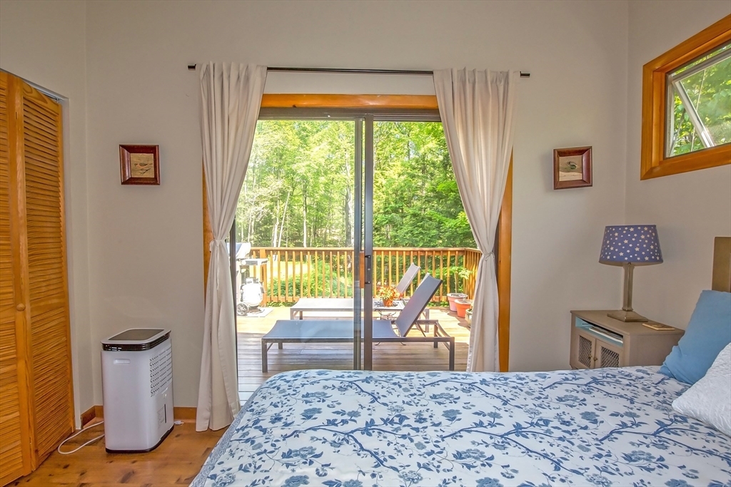 265 Fox Den Road Tolland, MA 01034 - Photo 12 of 37 a bedroom with a bed and a window