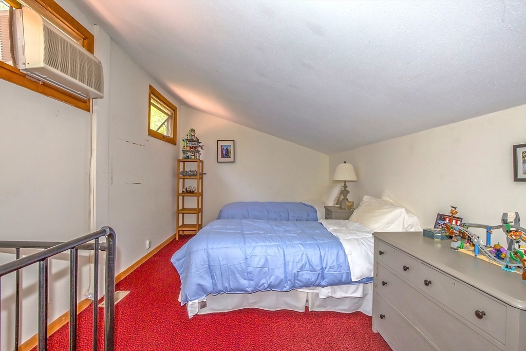 265 Fox Den Road Tolland, MA 01034 - Photo 13 of 37 a bedroom with a bed and a window