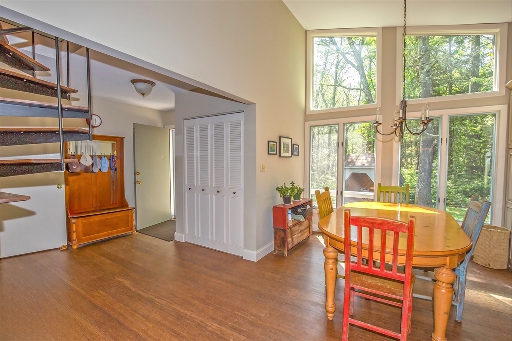 265 Fox Den Road Tolland, MA 01034 - Photo 16 of 37 a view of a dining room with furniture window and wooden floor
