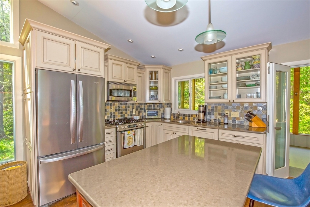 265 Fox Den Road Tolland, MA 01034 - Photo 18 of 37 a large kitchen with a large window and stainless steel appliances