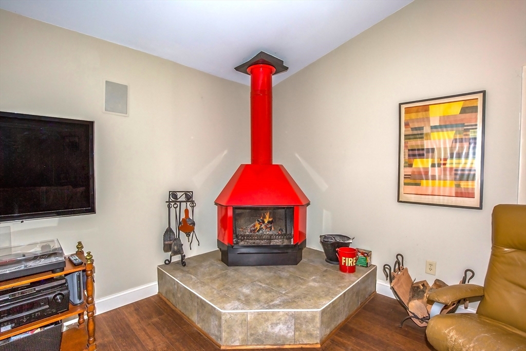 265 Fox Den Road Tolland, MA 01034 - Photo 20 of 37 a living room with furniture and a flat screen tv