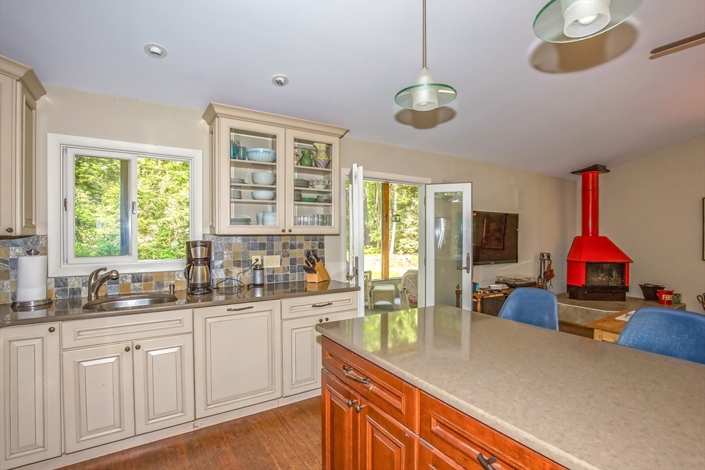 265 Fox Den Road Tolland, MA 01034 - Photo 21 of 37 a kitchen with a sink stove and cabinets