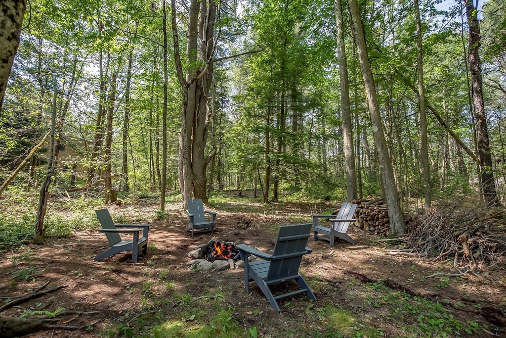 265 Fox Den Road Tolland, MA 01034 - Photo 5 of 37 a backyard of a house with outdoor seating
