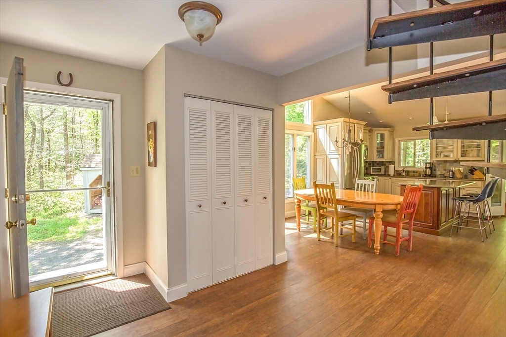 265 Fox Den Road Tolland, MA 01034 - Photo 6 of 37 a view of a dining room with furniture window and wooden floor