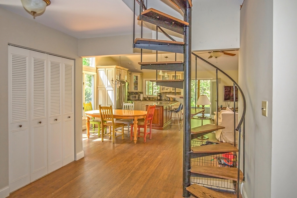 265 Fox Den Road Tolland, MA 01034 - Photo 8 of 37 a view of a hallway with wooden floor and furniture