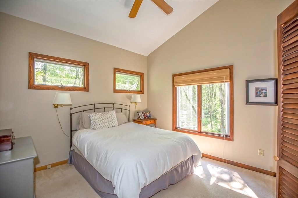 265 Fox Den Road Tolland, MA 01034 - Photo 9 of 37 a bedroom with a bed and a window