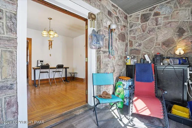 a view of empty room with wooden walls