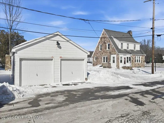 a brick building with a bench in front of it