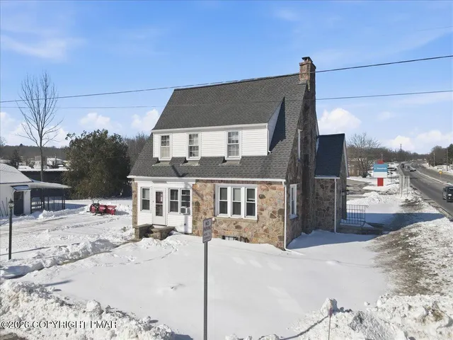a view of a bathroom with a sink and a mirror