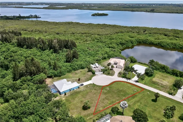 a view of a backyard with outdoor seating