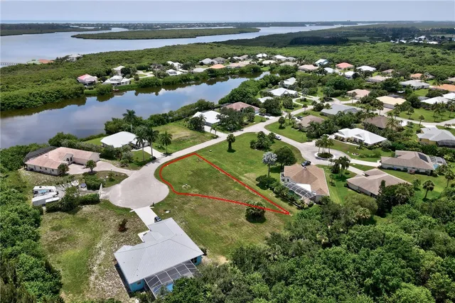 an aerial view of a house with a lake view