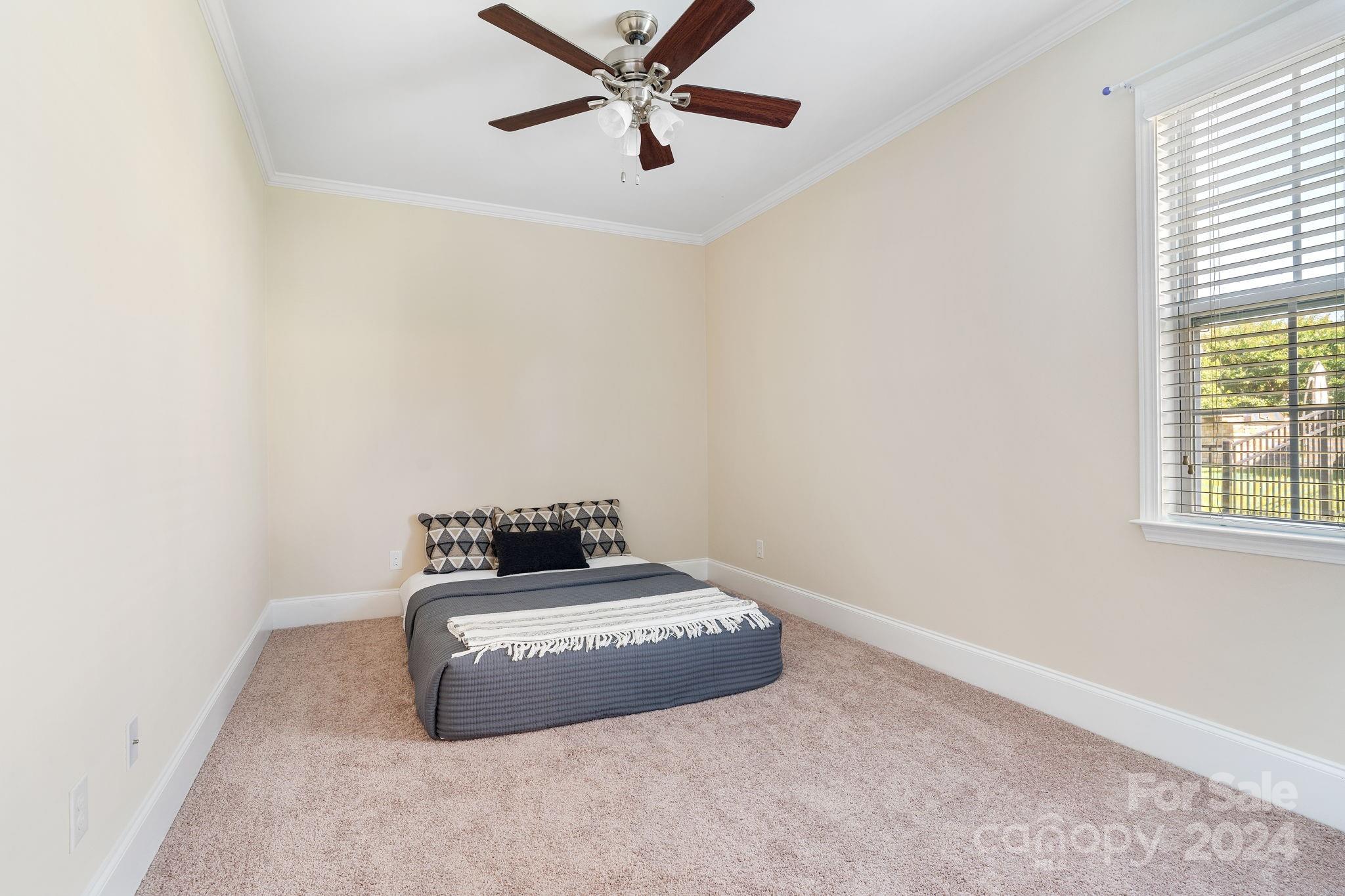 580 Rosemary Lane Fort Mill, SC 29708 - Photo 11 of 37 a bedroom with a bed and a window