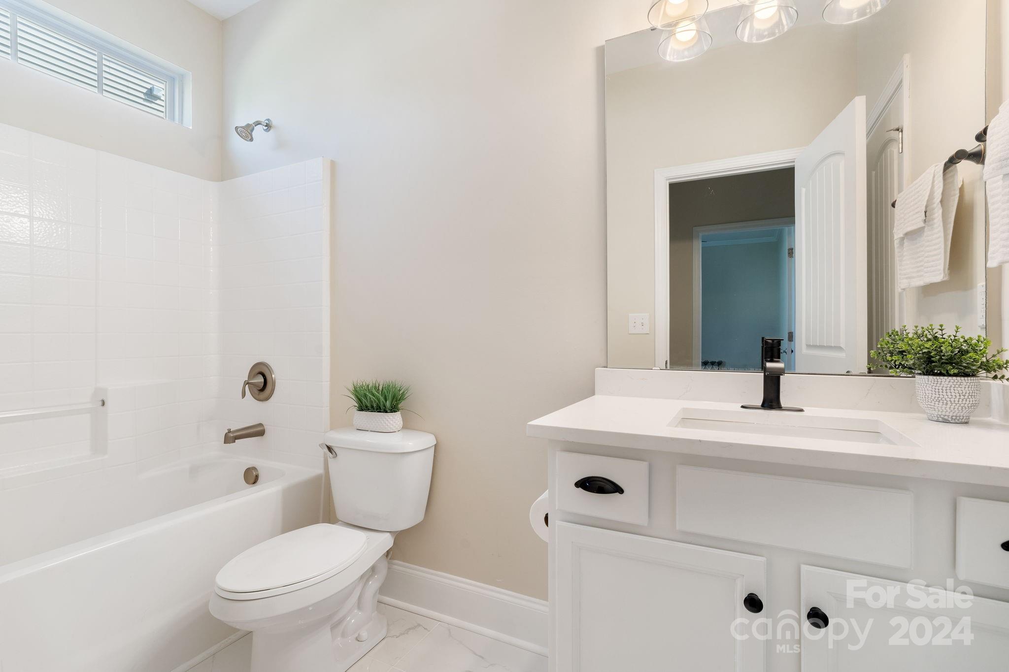 580 Rosemary Lane Fort Mill, SC 29708 - Photo 12 of 37 a bathroom with a sink a toilet and shower