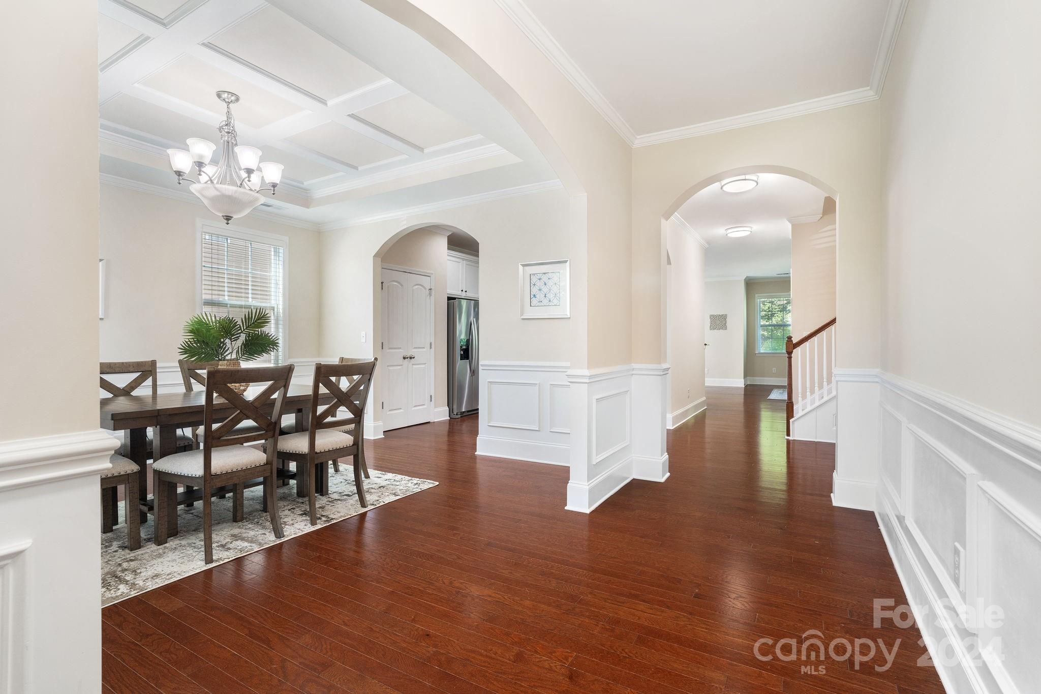 580 Rosemary Lane Fort Mill, SC 29708 - Photo 3 of 37 a view of a dining room with furniture and wooden floor