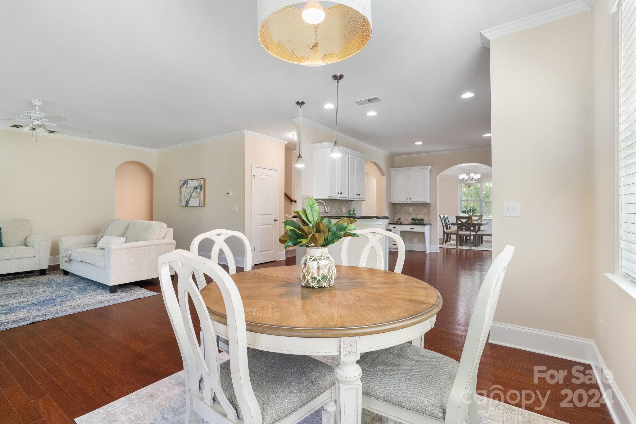580 Rosemary Lane Fort Mill, SC 29708 - Photo 8 of 37 a view of a dining room with furniture and wooden floor