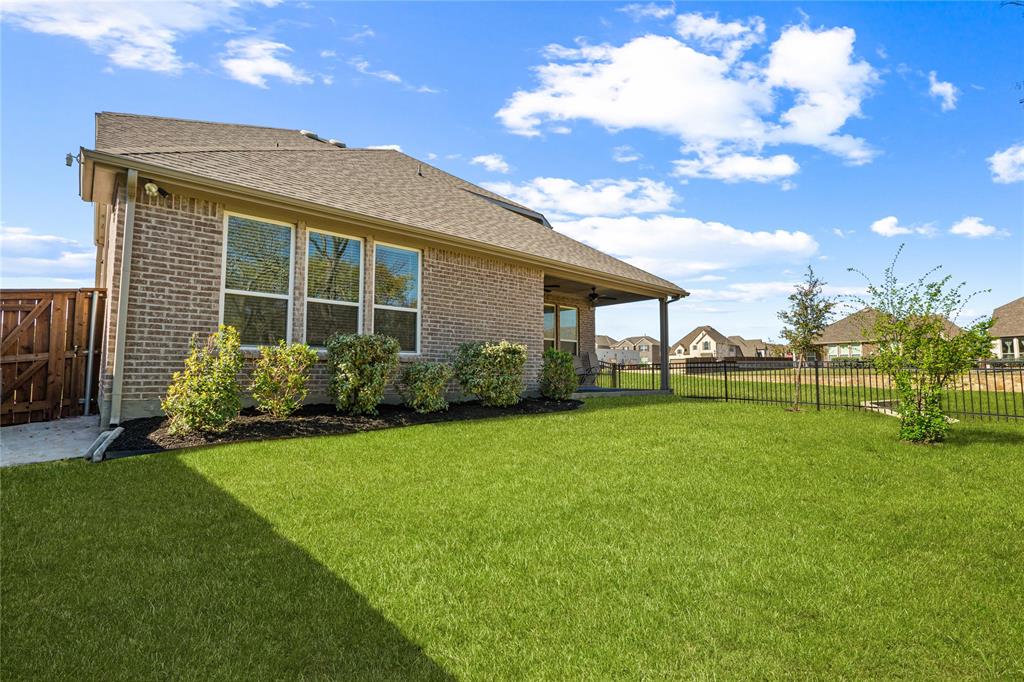 9517 Sunset Lane Oak Point, TX 75068 - Photo 39 of 40 9517 Sunset Lane, Oak Point, TX 75068 - back yard - view from private back yard that backs up to green space