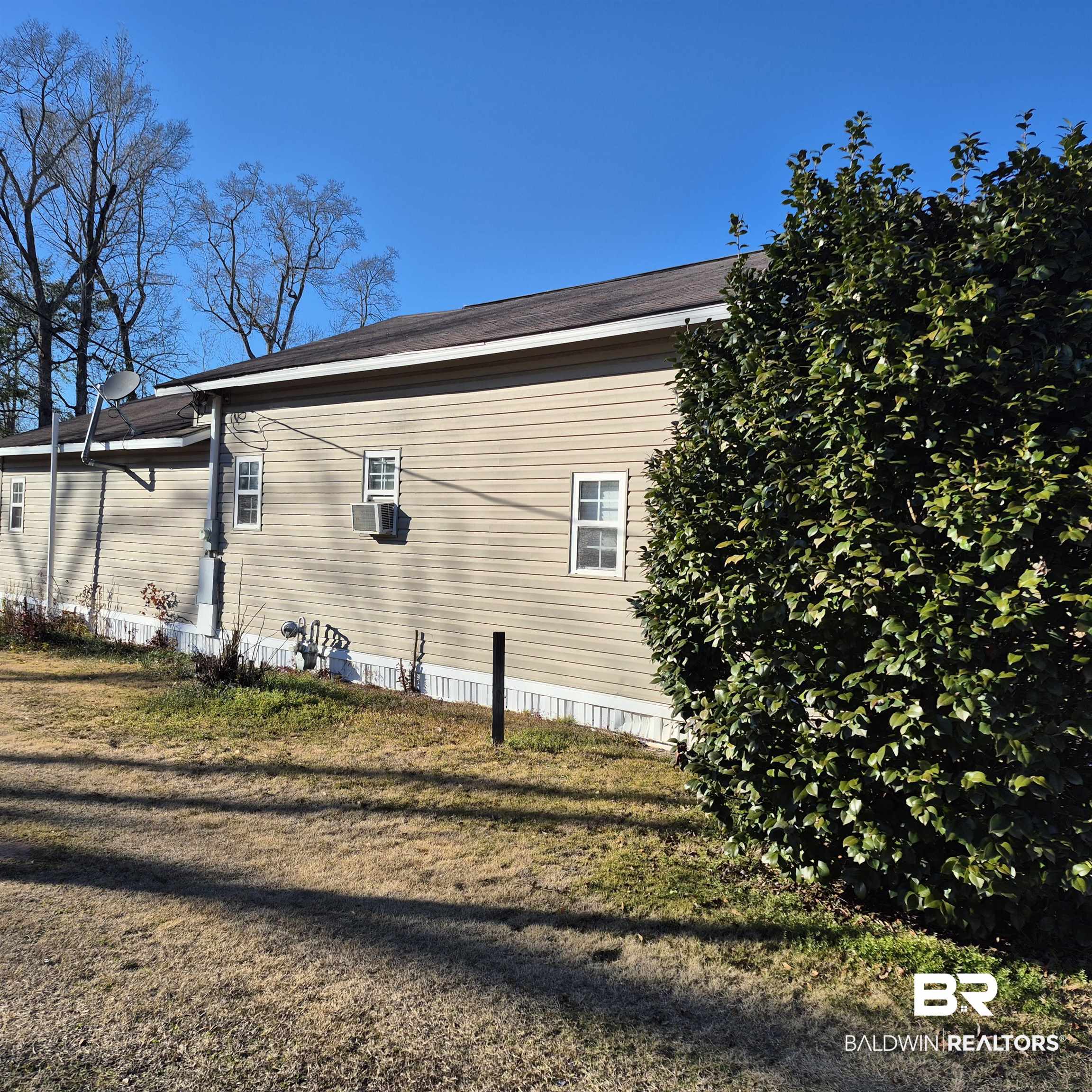 320 Bruner Avenue Evergreen, AL 36401 - Photo 14 of 15 View of property exterior with a yard