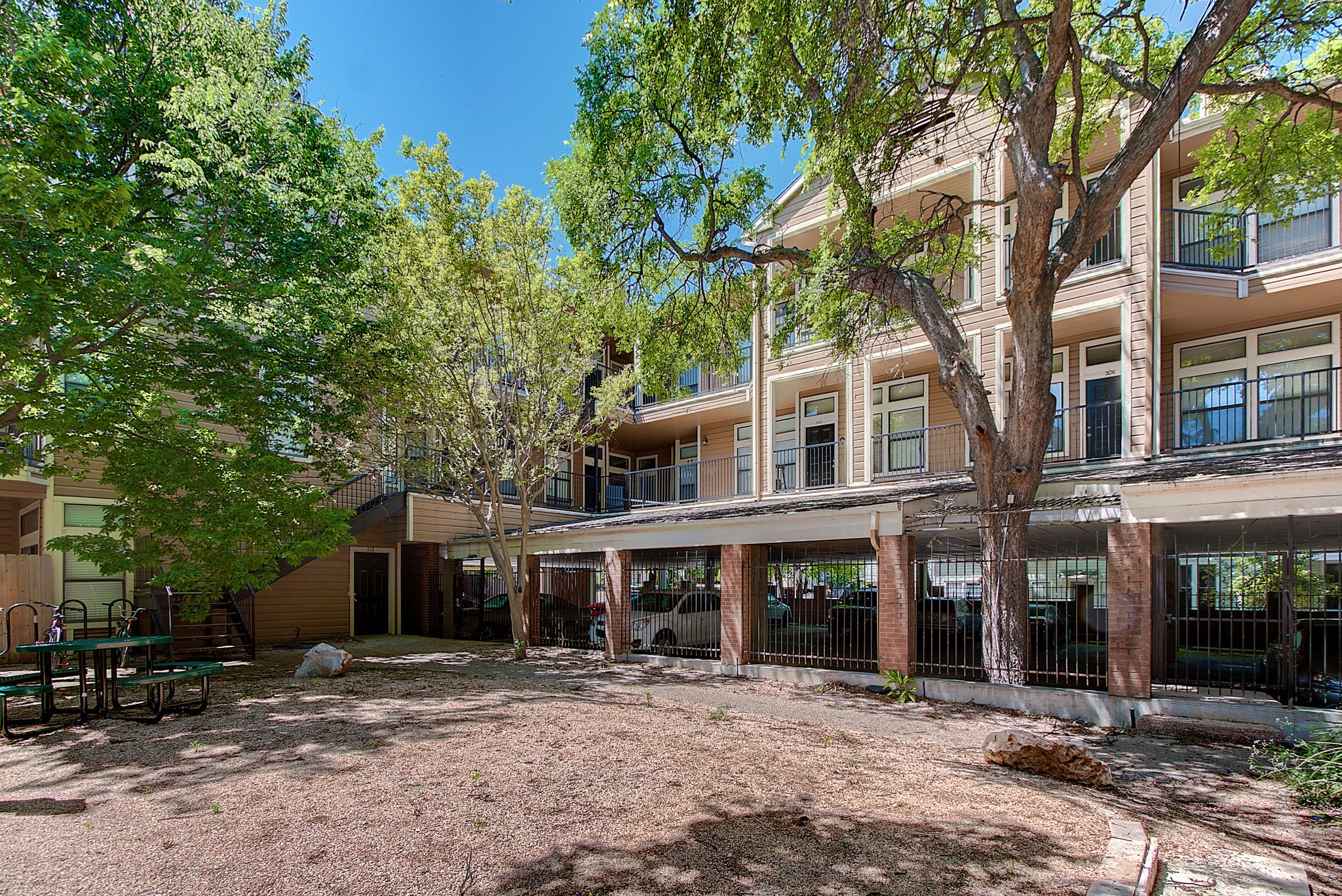 2802 Nueces Street, Unit 101 Austin, TX 78705 - Photo 3 of 20 a front view of a building with trees