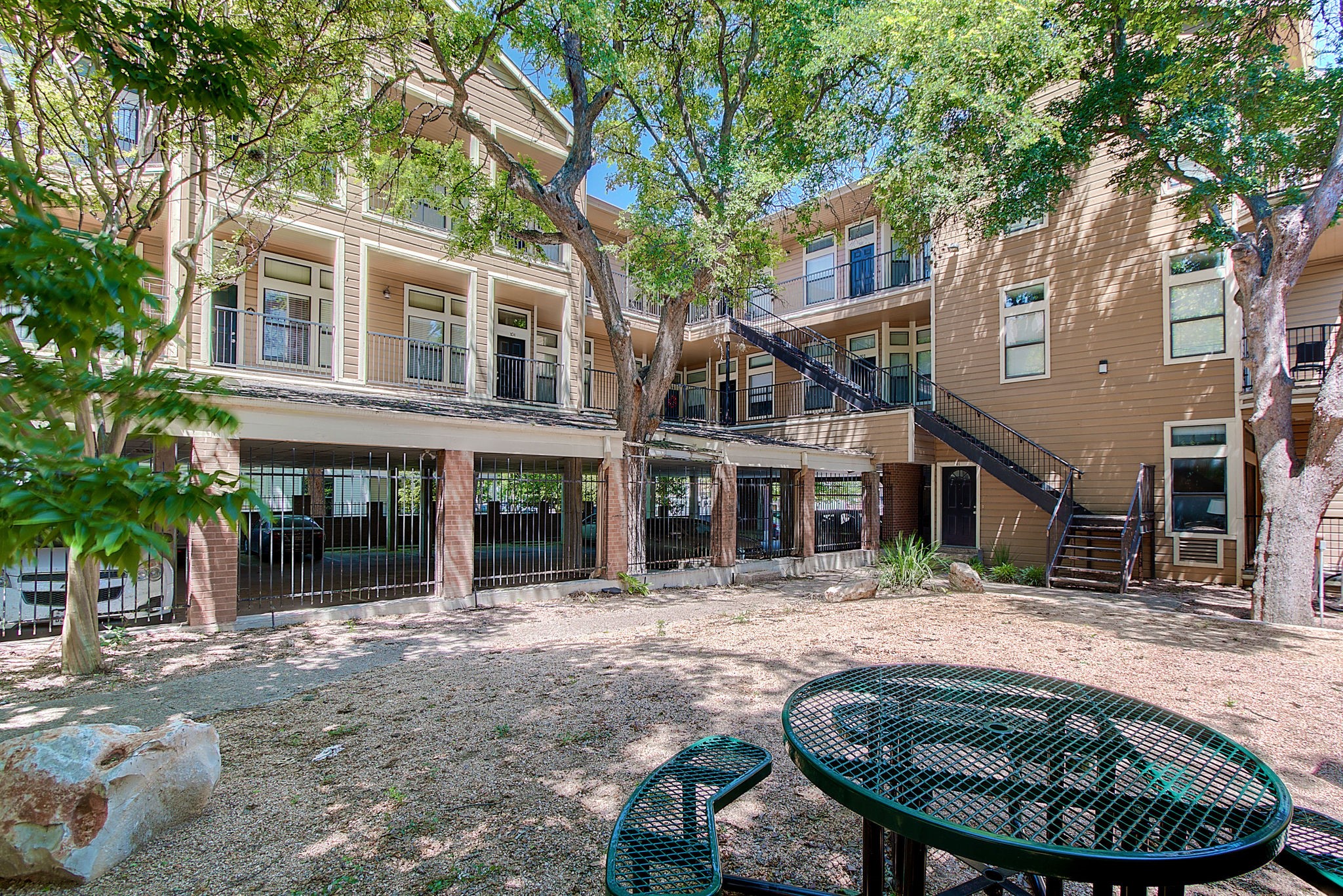 2802 Nueces Street, Unit 101 Austin, TX 78705 - Photo 4 of 20 a backyard of a house with yard and outdoor seating