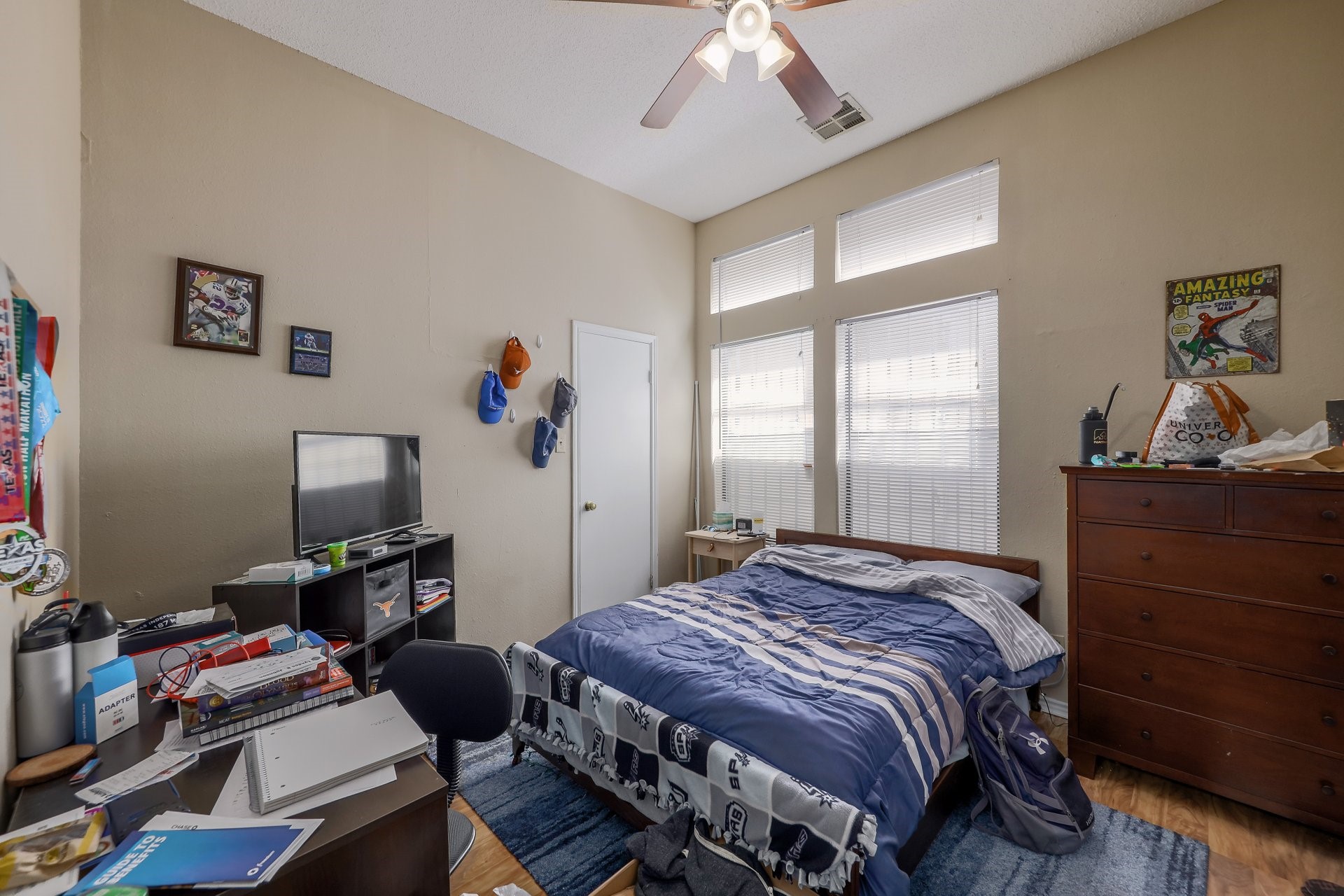 2802 Nueces Street, Unit 101 Austin, TX 78705 - Photo 9 of 20 a bedroom with a bed and a window