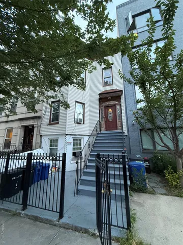 a view of a house with a small yard
