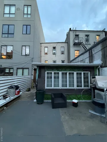 a front view of a building with many windows