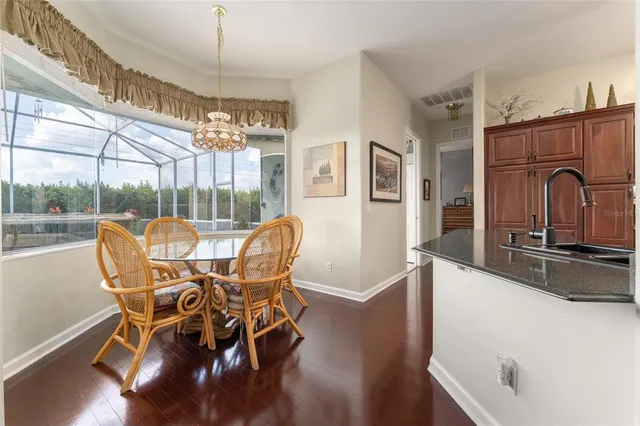 a kitchen with a sink a stove and cabinets