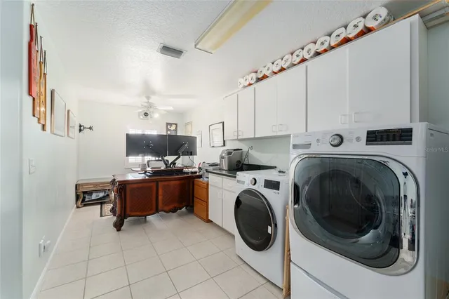 a bedroom with a bed and cabinets