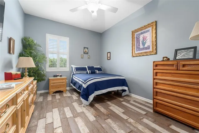 a bedroom with furniture and a chandelier