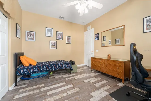 a bathroom with a sink vanity tub and shower